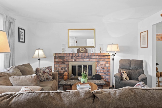 living area featuring a brick fireplace