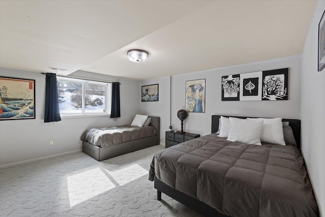 bedroom featuring baseboards and carpet floors