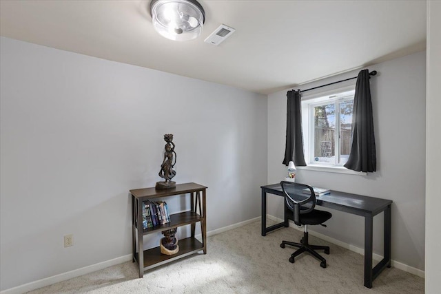 carpeted home office with visible vents and baseboards