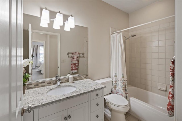 full bath with toilet, vanity, and shower / bath combination with curtain