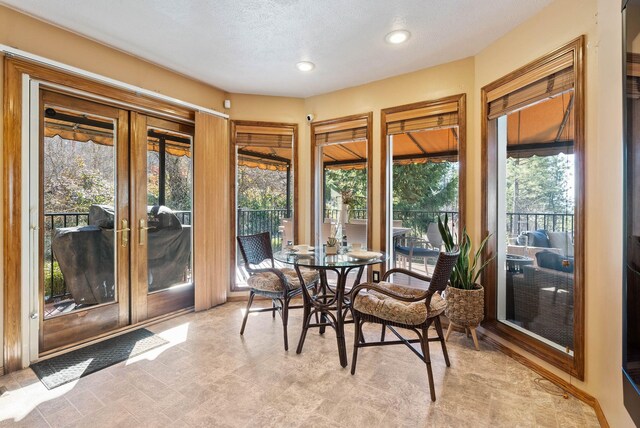 sunroom featuring french doors