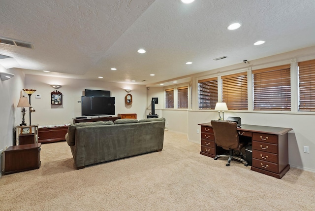 living room featuring carpet floors, visible vents, and recessed lighting