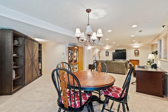 dining area with a textured ceiling, recessed lighting, a notable chandelier, light colored carpet, and visible vents