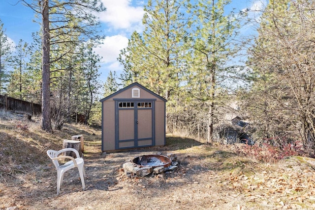 view of shed featuring a fire pit