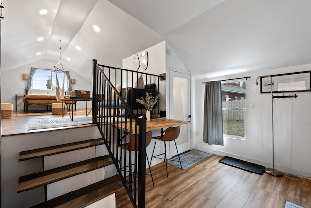 interior space with recessed lighting, stairway, vaulted ceiling, wood finished floors, and baseboards