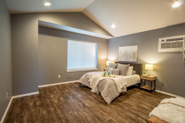 bedroom featuring baseboards, a wall unit AC, wood finished floors, vaulted ceiling, and recessed lighting