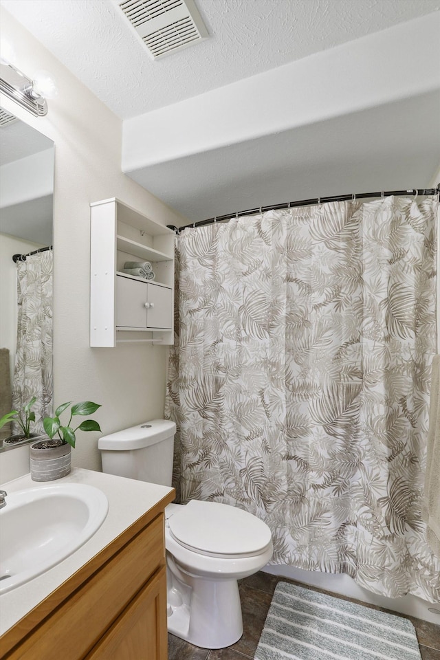 full bathroom with toilet, visible vents, a textured ceiling, and vanity