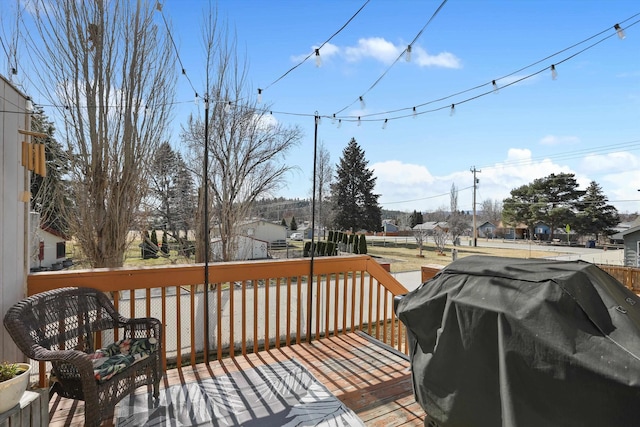 wooden deck featuring grilling area