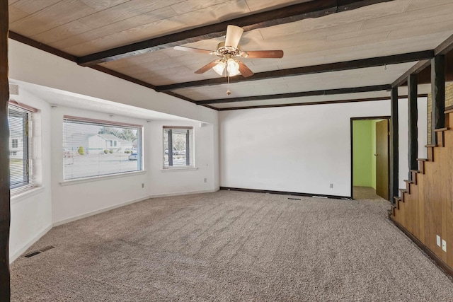 unfurnished room with light carpet, ceiling fan, beamed ceiling, and visible vents