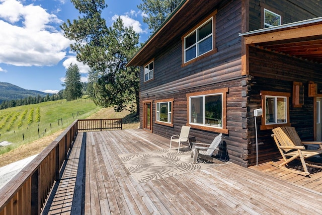 wooden deck featuring a mountain view