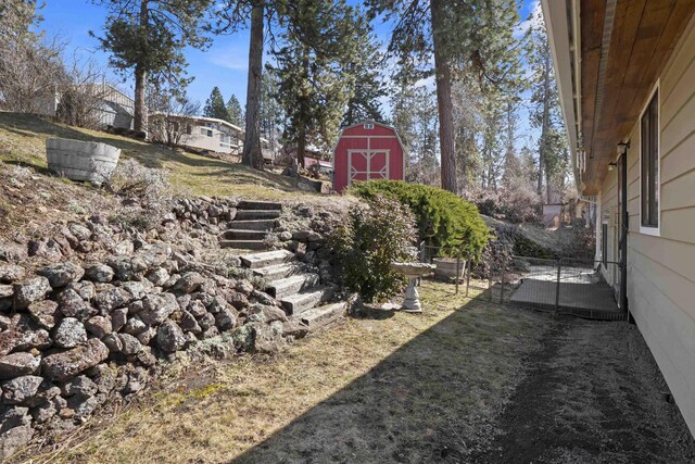 view of yard with an outbuilding and a barn