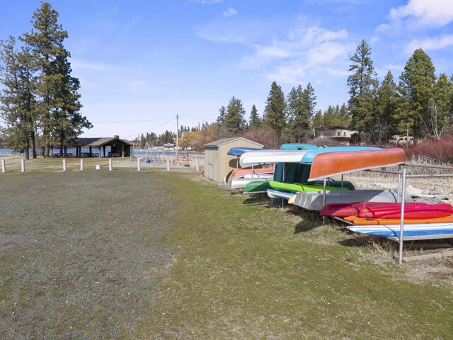 view of yard with an outbuilding and a storage shed