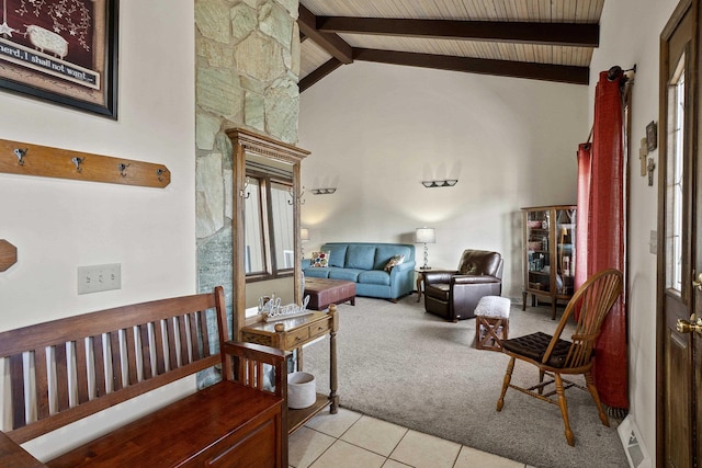 living room with light tile patterned floors, high vaulted ceiling, beam ceiling, and light colored carpet