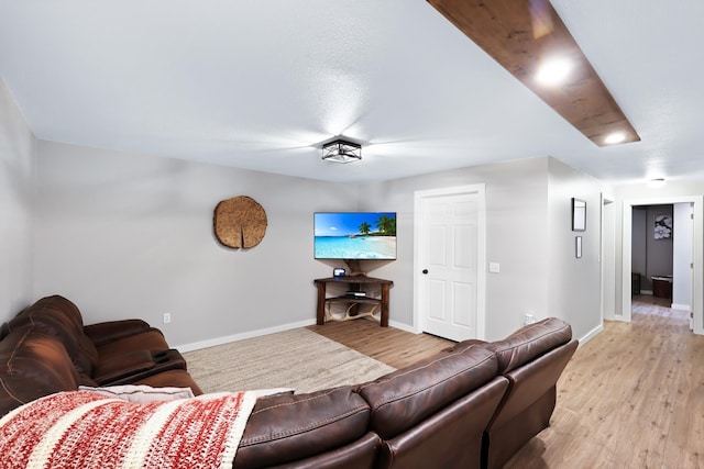 living room featuring light wood-style flooring and baseboards