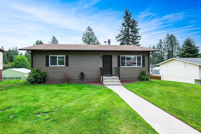 ranch-style home with a front yard