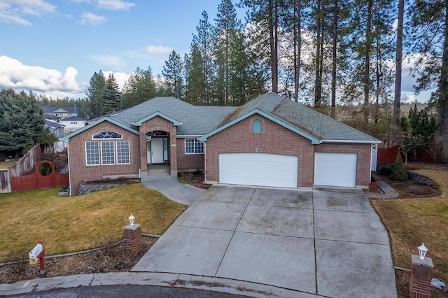 ranch-style house with a garage, driveway, a front lawn, and brick siding