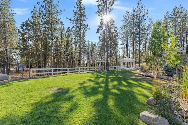 view of yard with a gazebo and fence