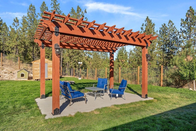 view of patio / terrace with an outbuilding, a pergola, and a shed