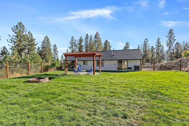 rear view of house featuring central air condition unit, a fire pit, a fenced backyard, and a pergola