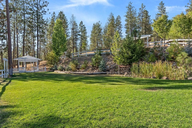 view of yard featuring a gazebo and fence