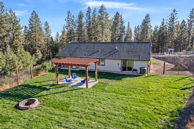 rear view of house with a patio area, fence private yard, an outdoor fire pit, and a pergola