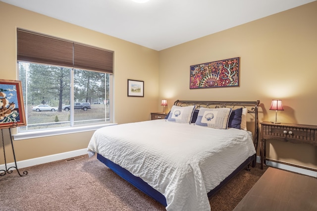 bedroom featuring visible vents, baseboards, and carpet floors