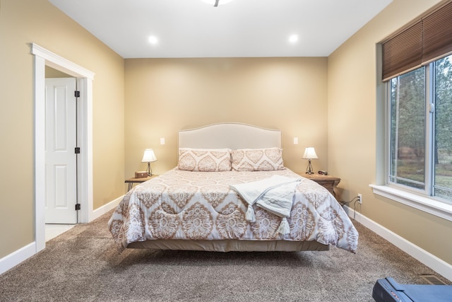 carpeted bedroom with recessed lighting and baseboards