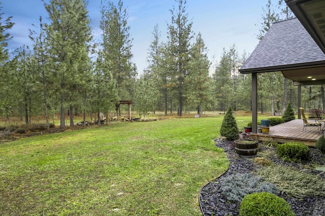 view of yard with a wooden deck