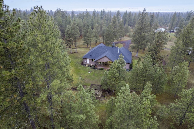 drone / aerial view featuring a view of trees