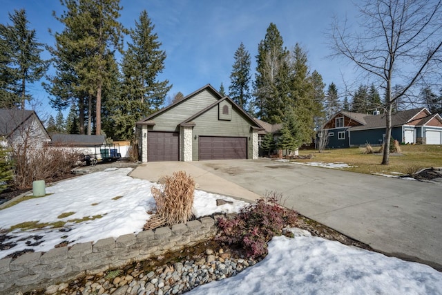 view of front facade with stone siding, concrete driveway, and an attached garage