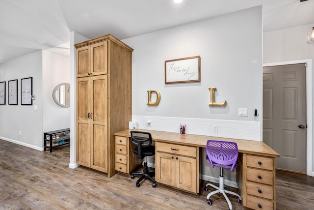 office area featuring baseboards and wood finished floors