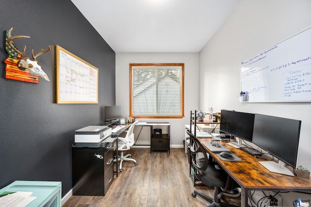 office area with wood finished floors and baseboards