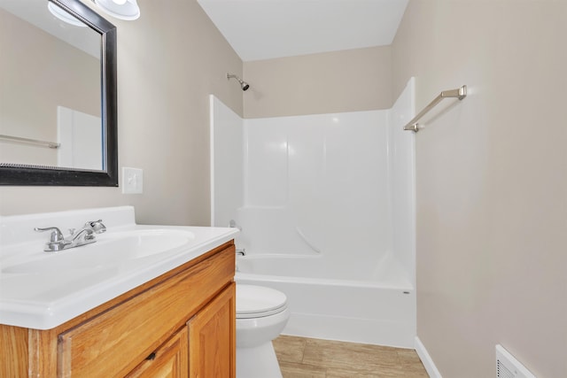 bathroom with tub / shower combination, visible vents, toilet, and vanity