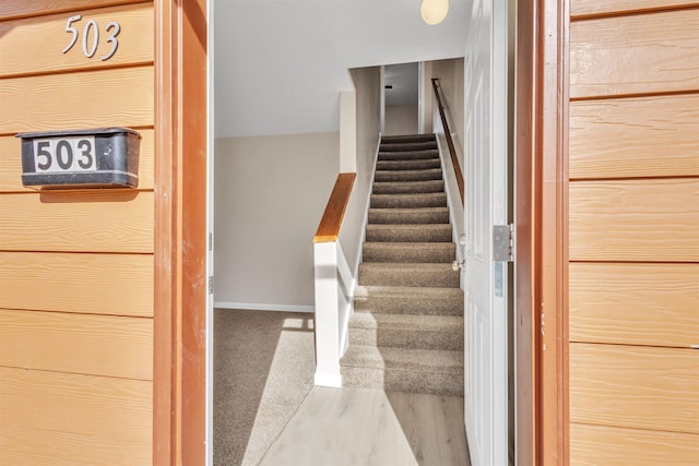 stairs featuring baseboards