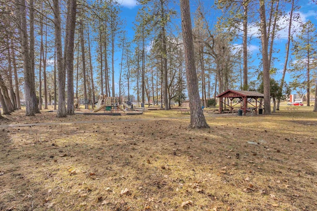 view of yard featuring a gazebo and a playground