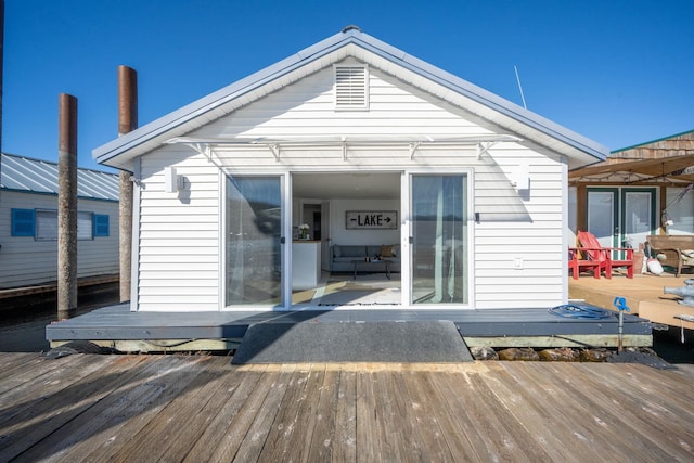 rear view of property with a deck