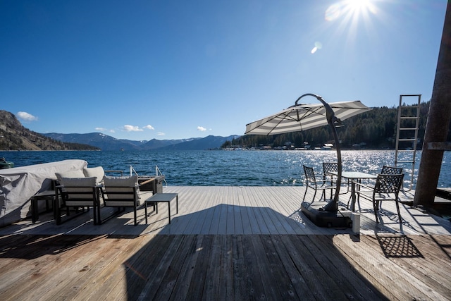 view of dock featuring a mountain view