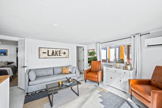 living room with finished concrete flooring and a wall unit AC