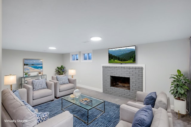 living room with carpet, a fireplace, and baseboards