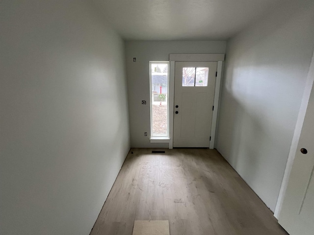 doorway with light wood-style floors