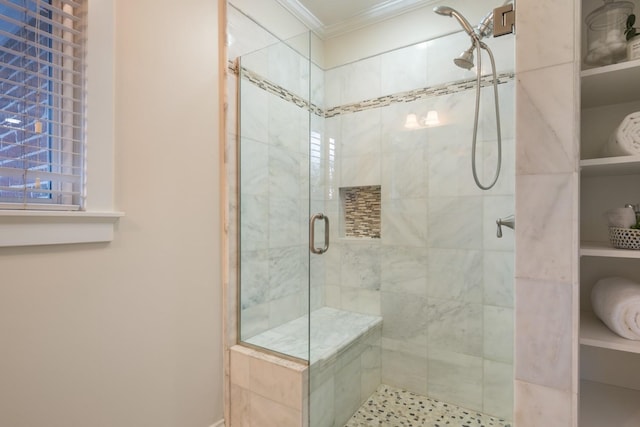 bathroom with a stall shower and ornamental molding