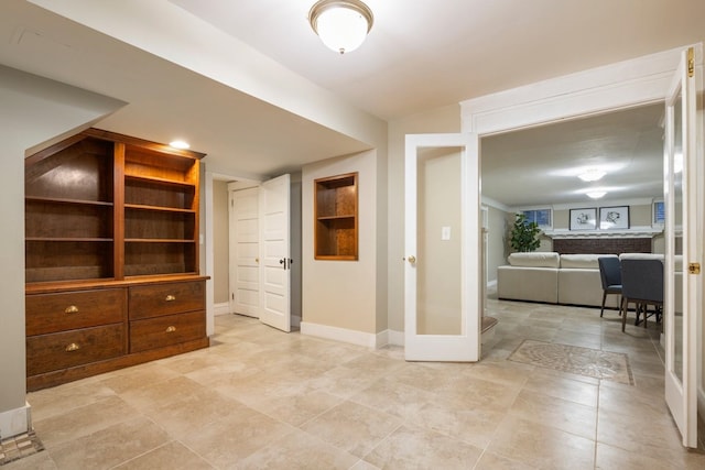 interior space featuring baseboards