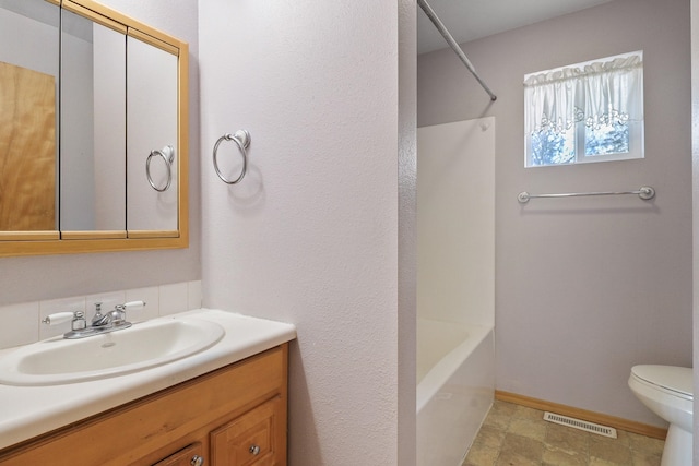 full bath with visible vents, toilet, shower / tub combination, baseboards, and vanity