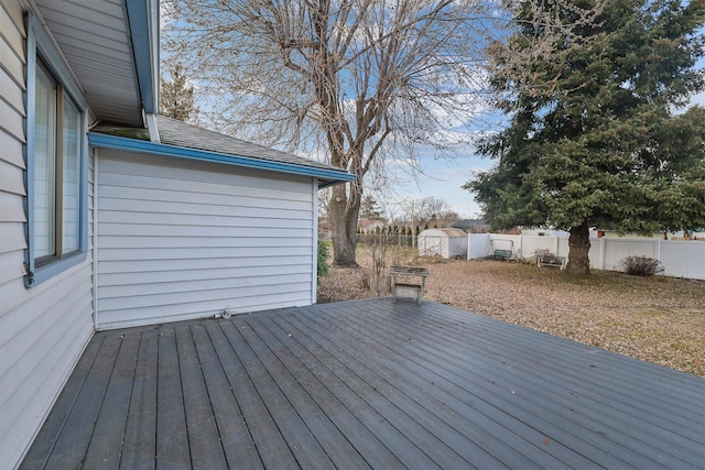 wooden deck featuring a fenced backyard