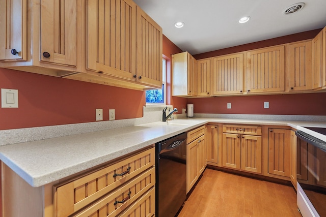 kitchen featuring visible vents, black dishwasher, recessed lighting, electric range, and a sink