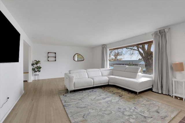 unfurnished living room with wood finished floors