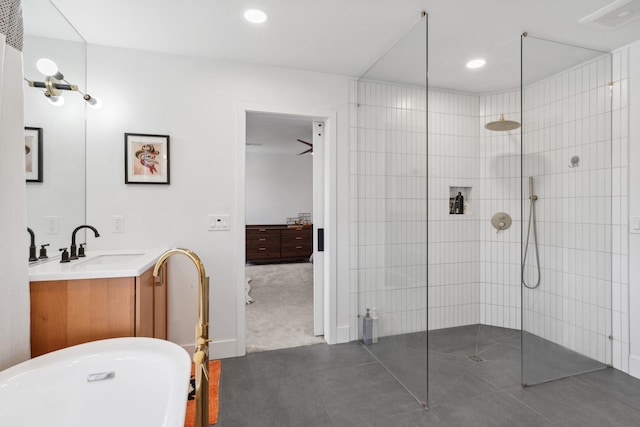 bathroom featuring a soaking tub, recessed lighting, vanity, and walk in shower