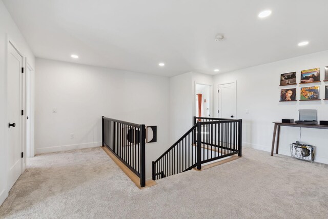 hallway with carpet, recessed lighting, an upstairs landing, and baseboards