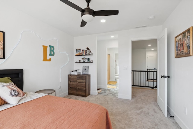 bedroom featuring baseboards, recessed lighting, visible vents, and light carpet