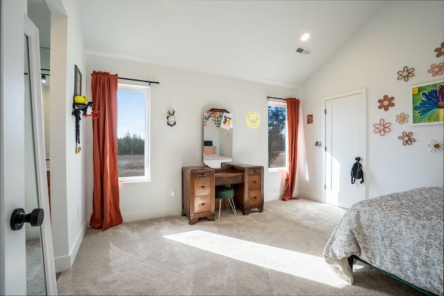 carpeted bedroom featuring visible vents, multiple windows, baseboards, and vaulted ceiling